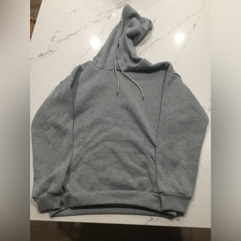 It is a ash grey hoodie and it is new